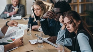 exhausted-businesspeople sitting_1920x1080