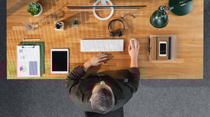 top-view-of-businessman-working-on-computer-at-desk_1920x1080