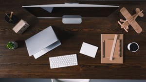 top-view-of-desktop-computer-laptop-and-office_1920x1080