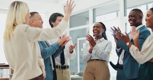 Happy, business people and applause with congratulations for winning, promotion or success at office. Group of employees clapping with smile for collaboration, teamwork or bonus together at workplace iStock-2151281608