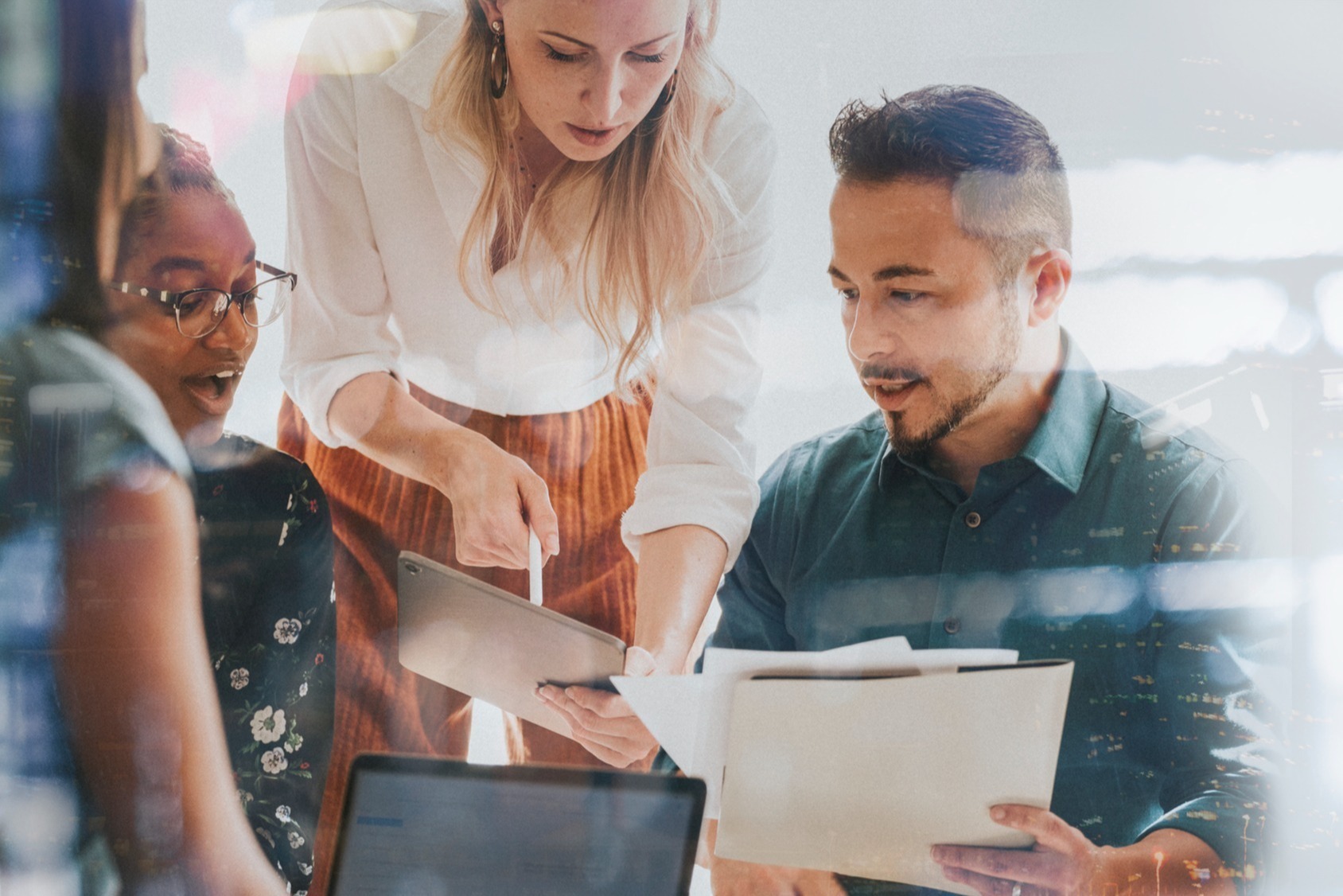 Business people working with a digital tablet in a meeting iStock-2158226013-1