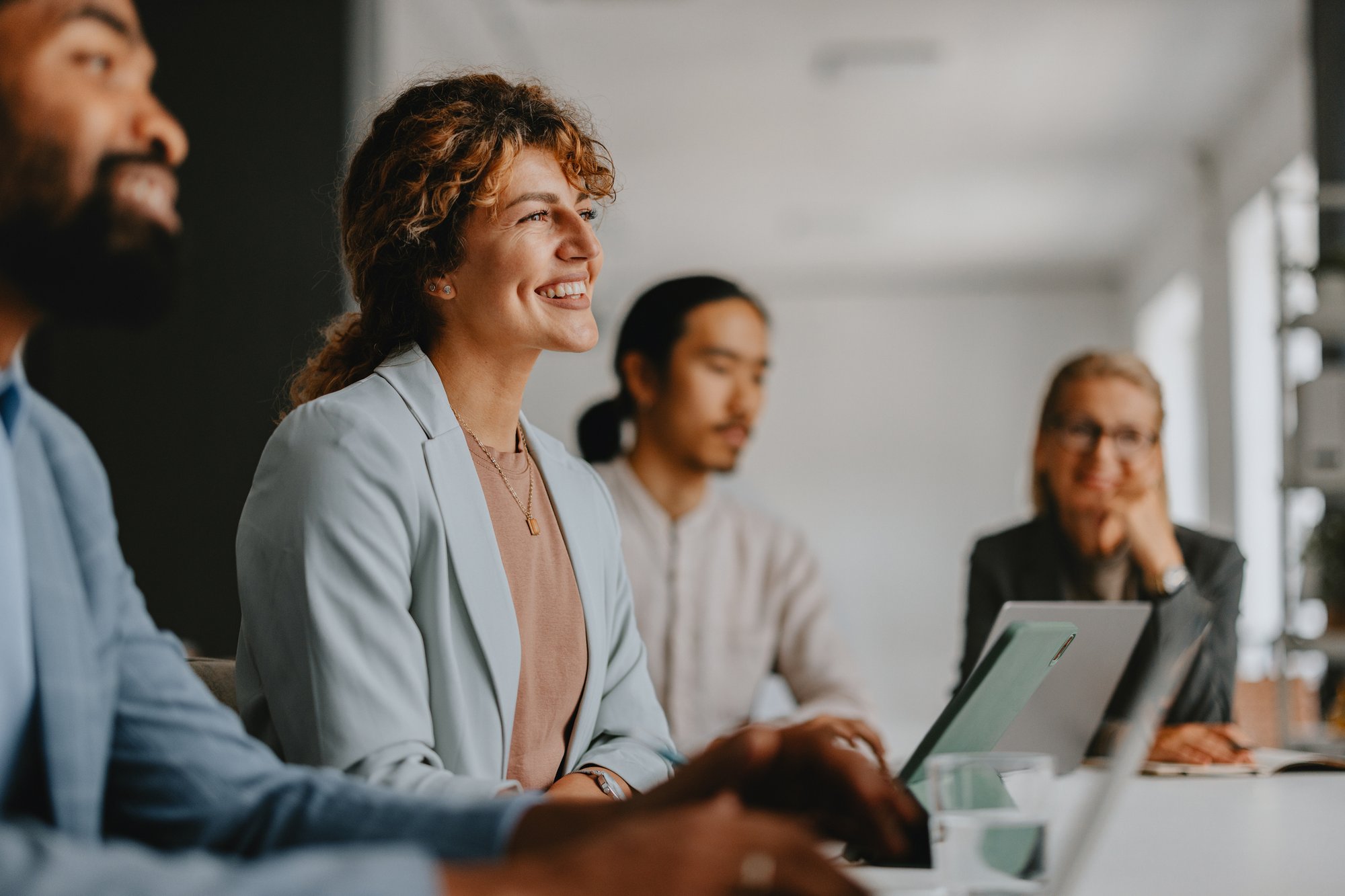 Diverse Group of Business Professionals Collaborating in Modern Office iStock-2160995068