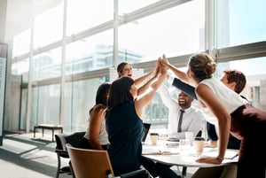 Portrait of a businessman and coworkers during presentation Teamwork High-Five  iStock-1143297195