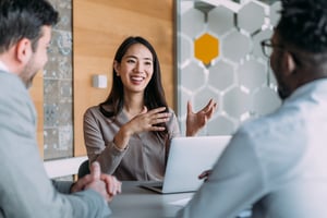Asian woman talking in the office. iStock-2163365819