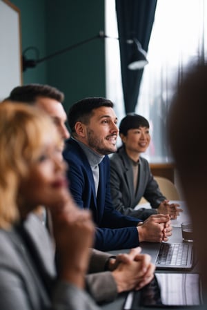 Businesswomen and men Working On their Laptop iStock-1983487451