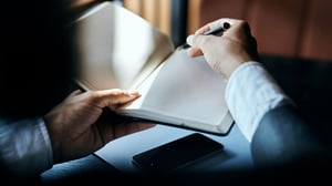 businessman taking notes_1920x1080