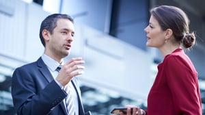 businessman-and-woman-talking_1920x1080