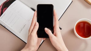 hands-with-smartphone-near-cup_1920x1080