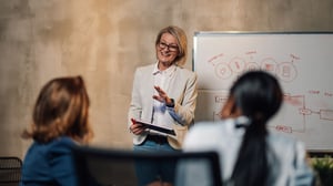 senior-business-woman-holding-a-meeting_1920x1080