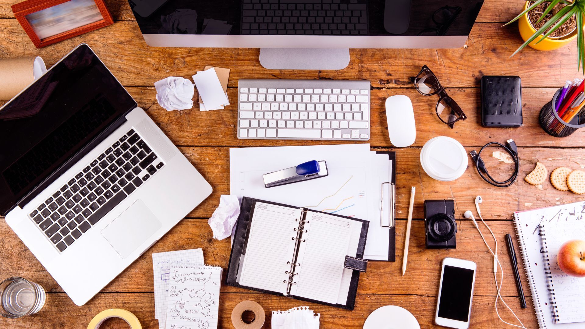 desk-with-various-gadgets-and-office-supplies_1920x1080