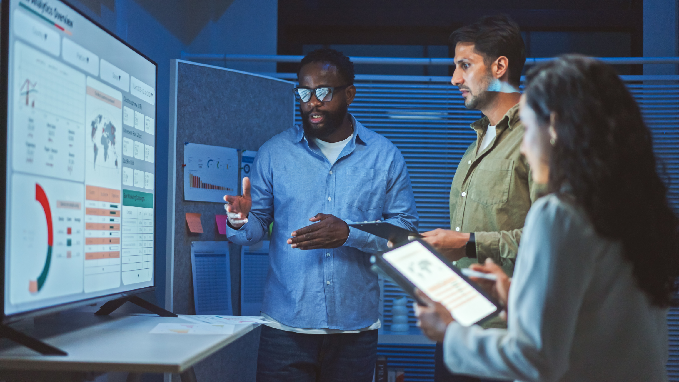 Data analytics team meeting at night. iStock-2166193783