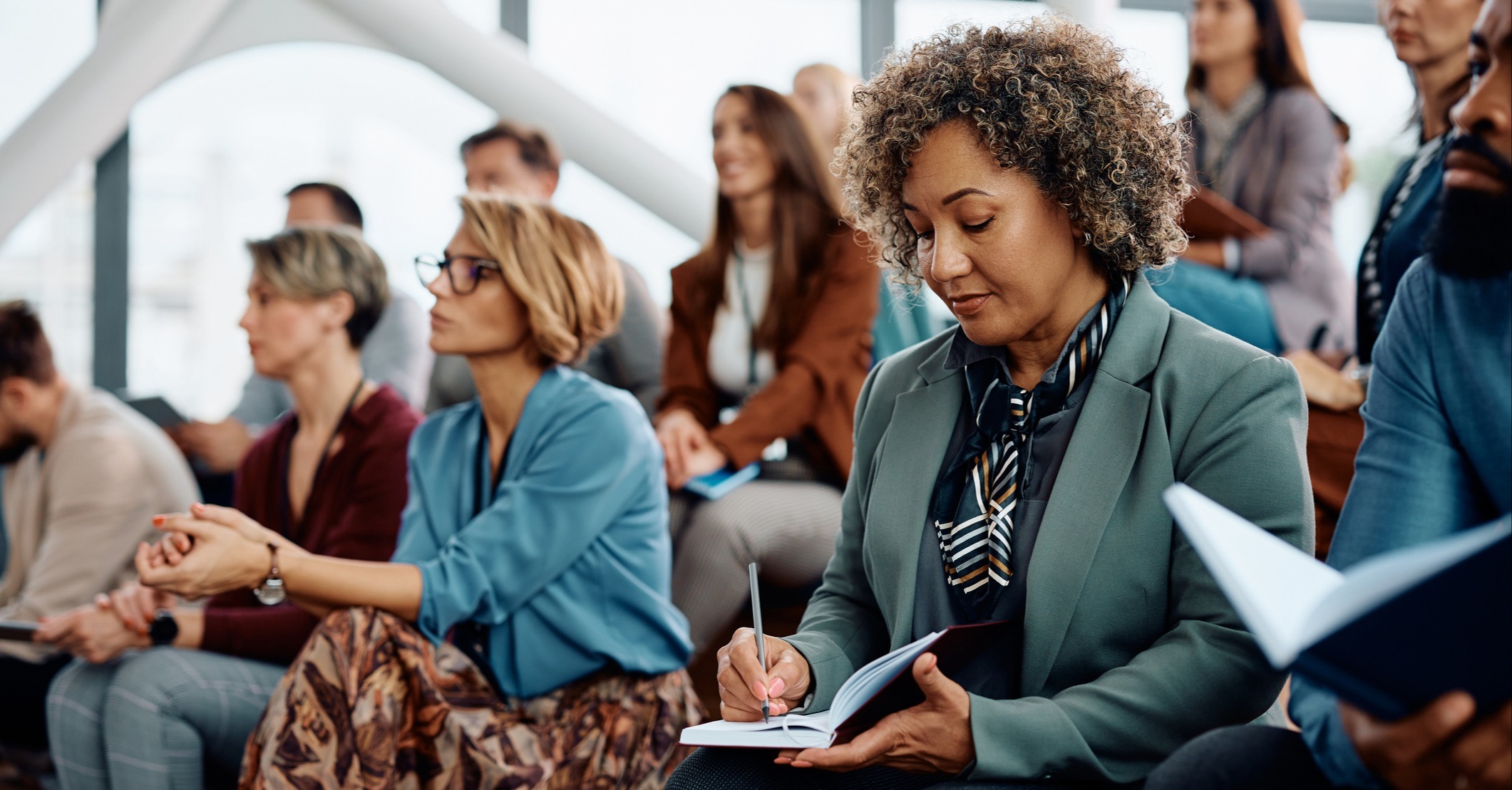 Home_ Business Woman taking notes_iStock-1783743688