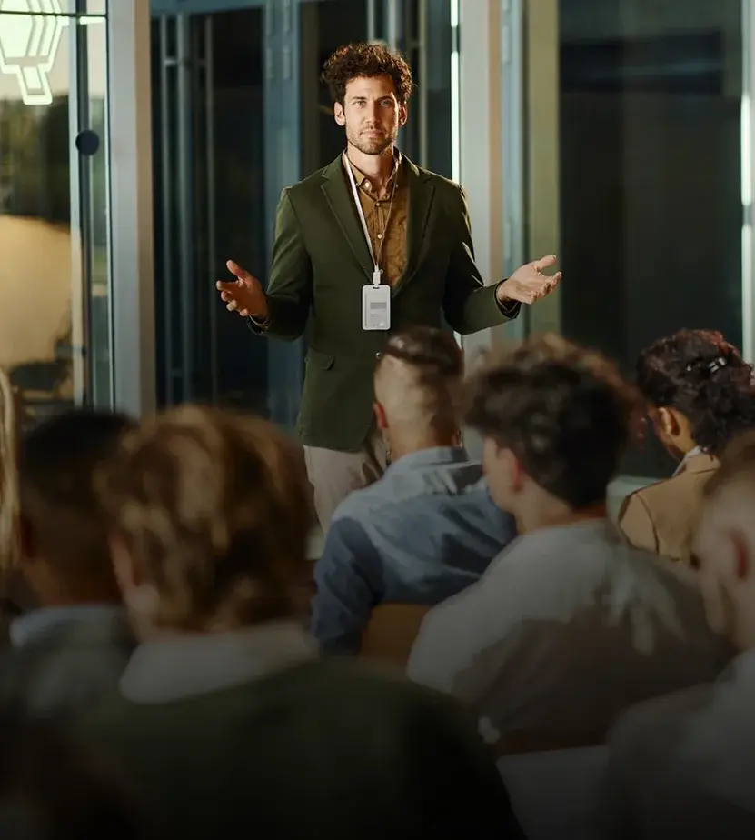 Male CEO talking to his colleagues on education event in board room iStock-2164304363 1