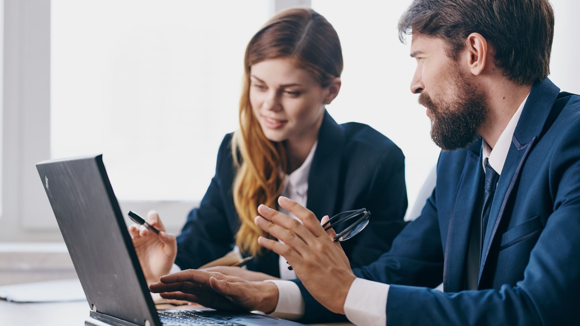 business-man-and-woman-talking_1920x1080